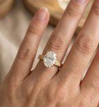 Front-facing on-hand perspective of 4 CT oval lab grown diamond vintage engagement ring.