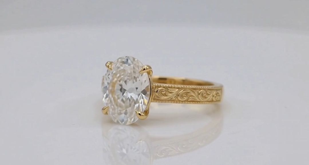 Three-quarter view of 4 CT oval lab diamond engagement ring showcasing brilliant cut and band detailing.