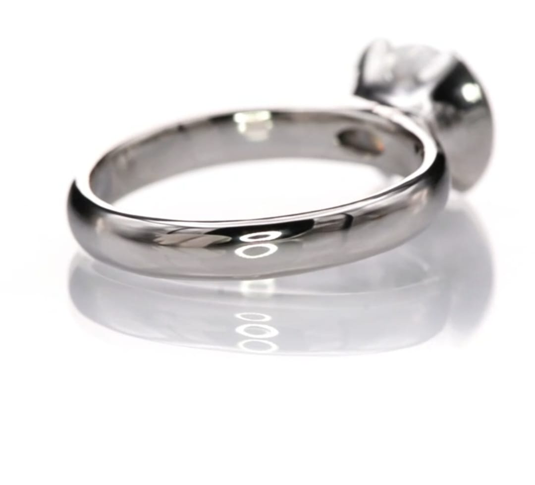 Angled view showing the smooth high-polished band of the 2 CT round lab diamond solitaire ring.