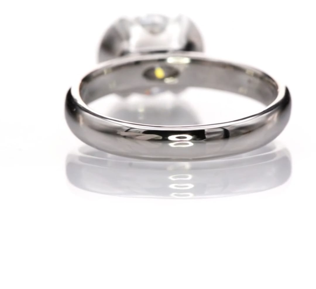 Rear view of the high-polished white gold band and under-gallery of the 2 CT round lab diamond ring.