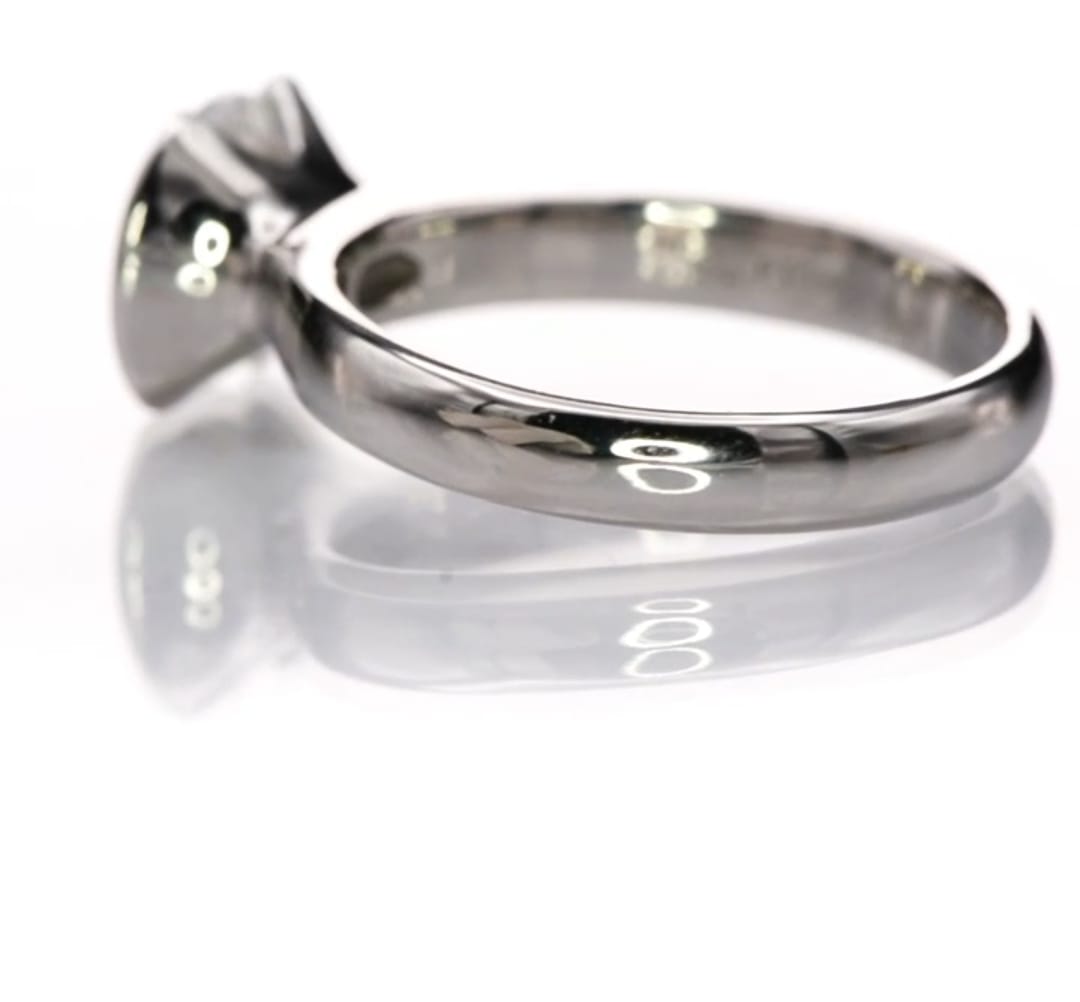 Detailed side angle of the half-bezel mount and sleek polished shank on the 2 CT round lab diamond ring.