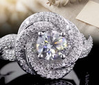 Top-down close-up view of a 2 CT round lab grown diamond surrounded by a swirling pave halo frame.