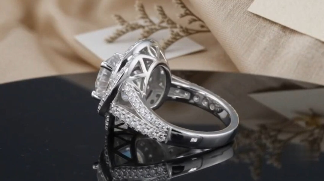 Side profile shot showing the openwork lattice undergallery and split pave band of a 2 CT round ring.