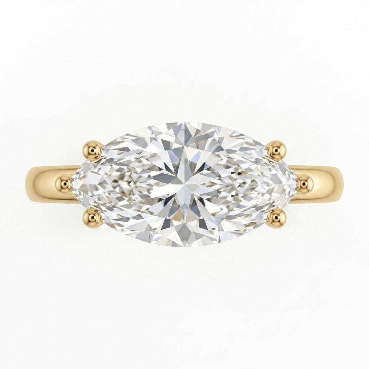 Top-down view of a 3 CT marquise cut lab diamond set horizontally in an East-West yellow gold ring.