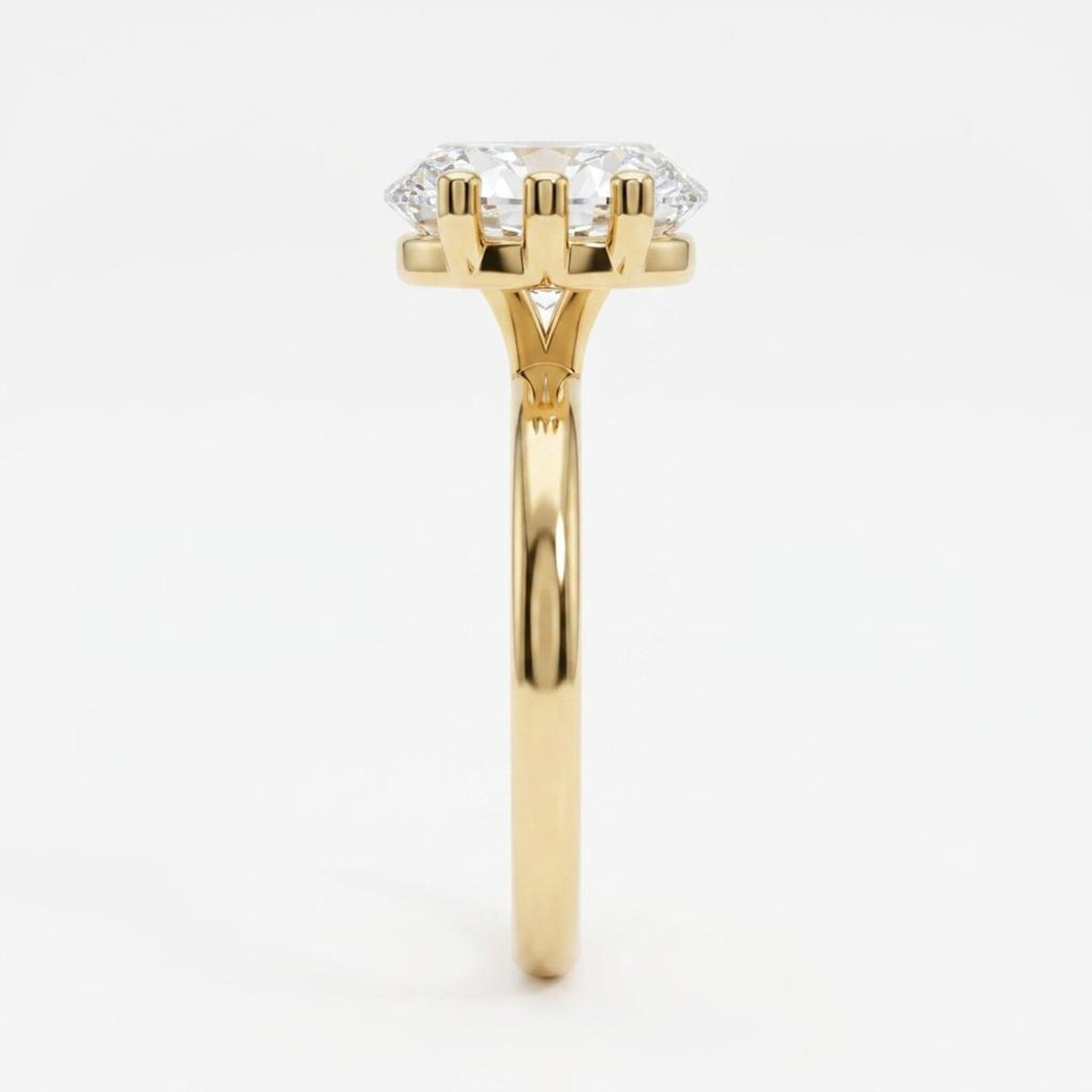 Side view showing the six-prong basket gallery holding a horizontal marquise diamond on a thin band.