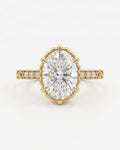 Top-down view of a 4 CT oval lab grown diamond ring in a scalloped yellow gold crown setting with accent diamonds.