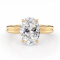 Front view of a 4 CT oval lab grown diamond ring with a double-wire band in yellow gold.