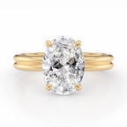 Front view of a 4 CT oval lab grown diamond ring with a double-wire band in yellow gold.