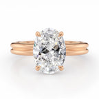 Front view of a 4 CT oval lab grown diamond solitaire ring on a rose gold double-rail band.