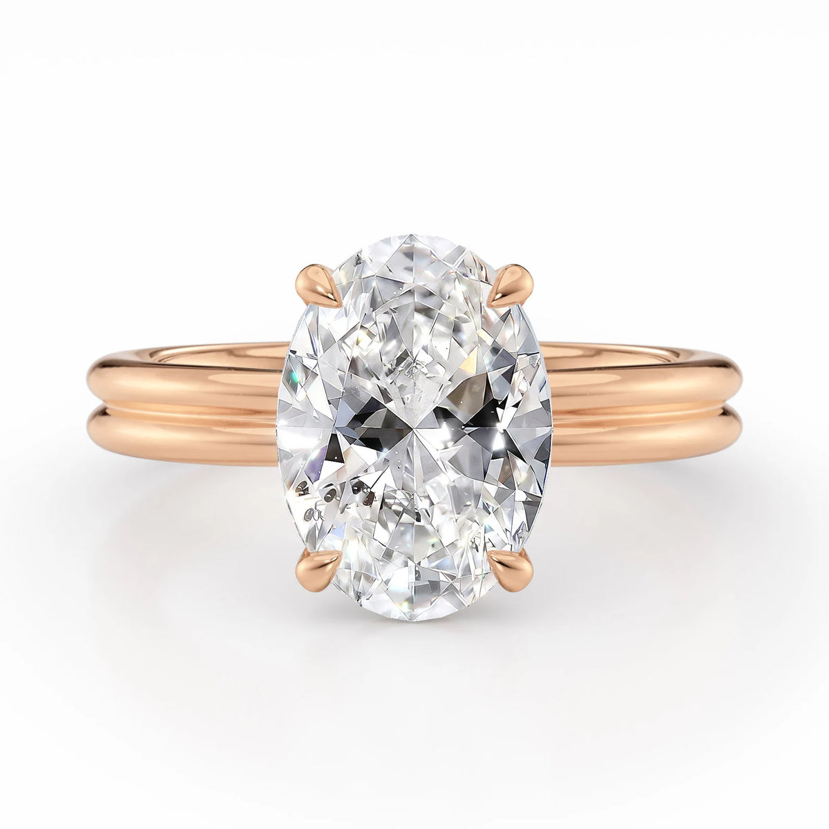 Front view of a 4 CT oval lab grown diamond solitaire ring on a rose gold double-rail band.