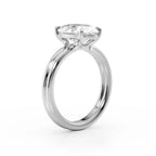 Side profile view of a 4 CT oval lab grown diamond solitaire ring on a white gold double band.