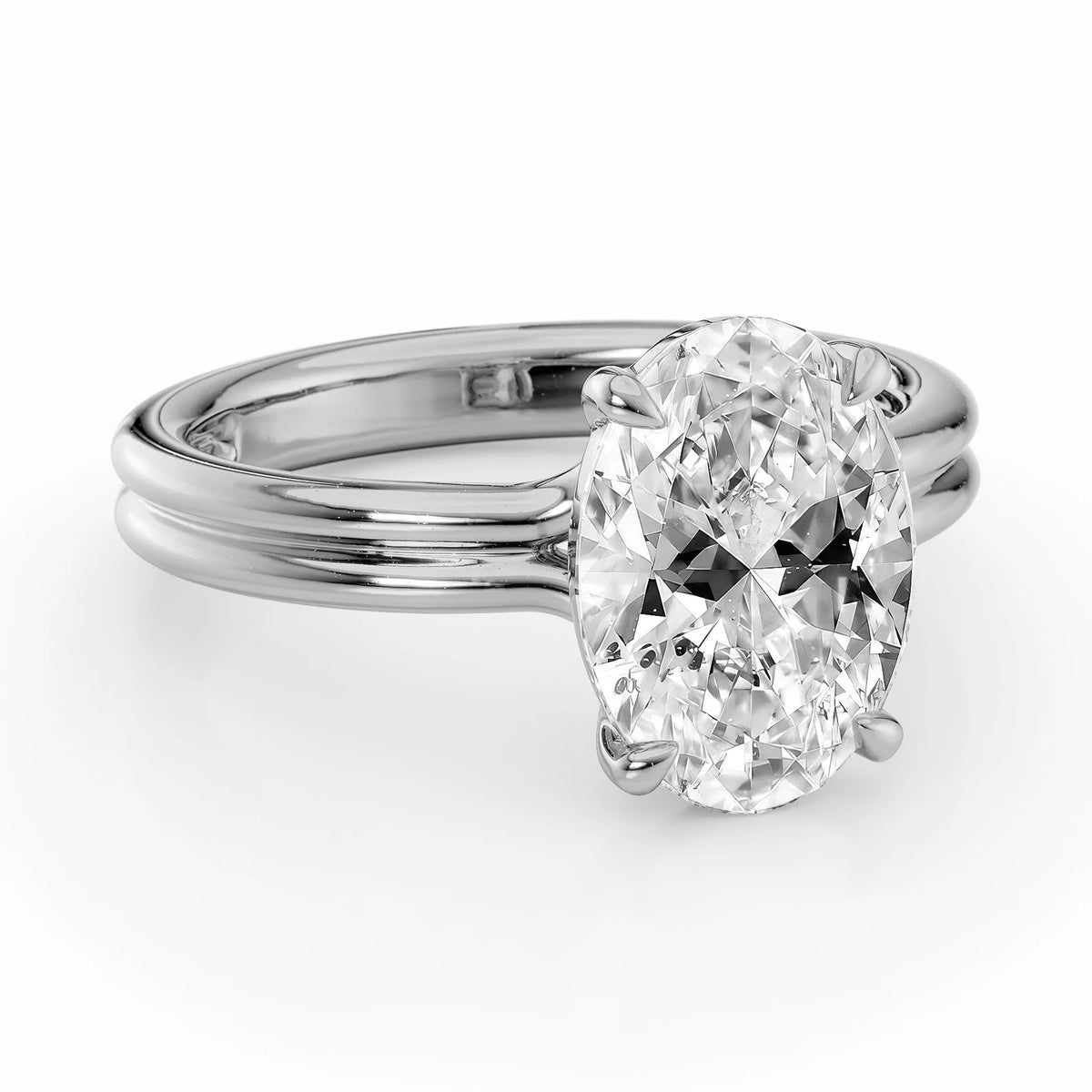 Angled view of a 4 CT oval lab grown diamond ring with a white gold double-wire shank.