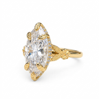 Angled view showing the 4 CT marquise lab grown diamond with leaf-textured prongs and floral shank detail.