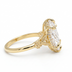Side profile view showcasing the botanical leaf and flower setting on a 4 CT marquise lab grown diamond ring.