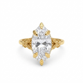 Top-down view of a 4 CT marquise cut lab grown diamond engagement ring with sculpted leaf prongs and floral shoulders.