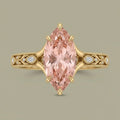 Top-down view of a 3 CT fancy pink marquise lab grown diamond engagement ring with split shoulders and milgrain detail.
