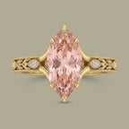 Top-down view of a 3 CT fancy pink marquise lab grown diamond engagement ring with split shoulders and milgrain detail.