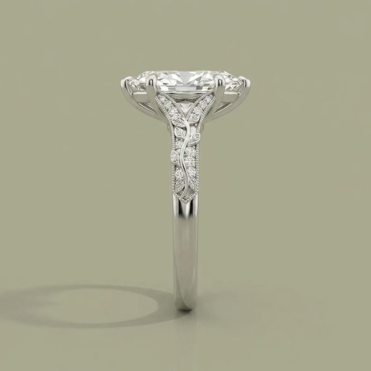 Side profile of a 4 CT marquise lab grown diamond ring featuring botanical leaf engraving and milgrain detailing.