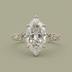 Top-down view of a 4 CT marquise cut lab grown diamond ring with two-tone yellow gold leaf accents and pave diamonds.