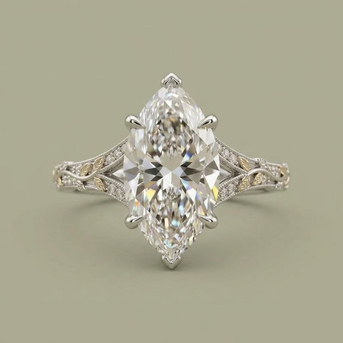 Top-down view of a 4 CT marquise cut lab grown diamond ring with two-tone yellow gold leaf accents and pave diamonds.
