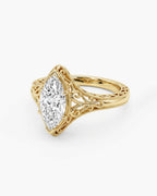 Three-quarter view of a 4 CT marquise lab grown diamond engagement ring with vintage yellow gold filigree.