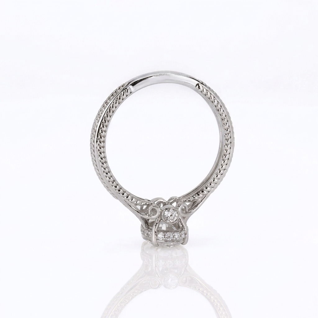 Profile view of the vintage scrollwork gallery with a bezel-set accent diamond in a white gold lab grown diamond setting.