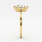 Side profile of a 3 carat oval lab diamond engagement ring showing the detailed fluted cup gallery in yellow gold.