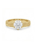 Top-down view of a 3 CT round cut lab grown diamond engagement ring in a 6-prong yellow gold setting with hand-carved scrollwork band.