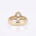 Bottom profile showing the interior polished yellow gold band and split shank architecture of a marquise diamond ring.