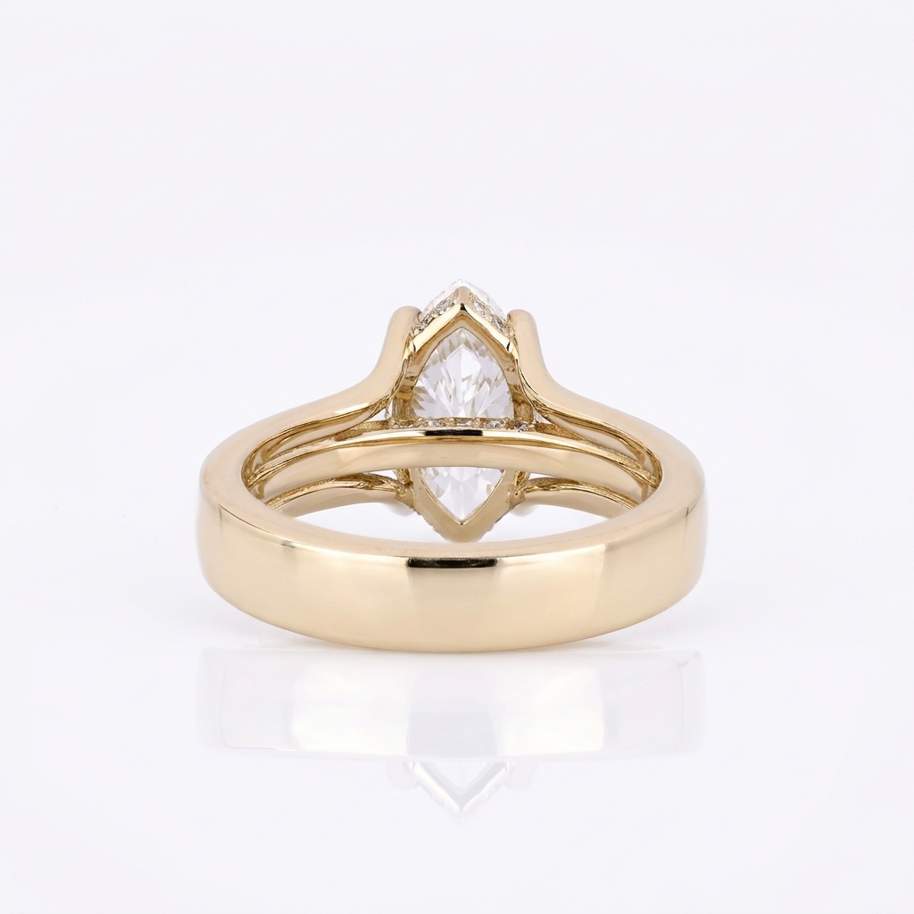 Bottom profile showing the interior polished yellow gold band and split shank architecture of a marquise diamond ring.