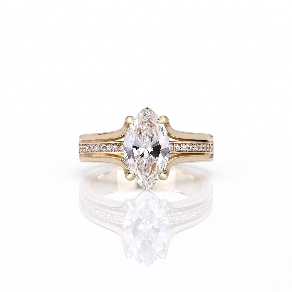 Direct top-down view of a 3 carat marquise cut lab created diamond set on a yellow gold split pavé band.