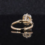 Low-angle side view of a 2 CT radiant cut lab grown diamond engagement ring showing the yellow gold band and hidden pavé halo gallery.