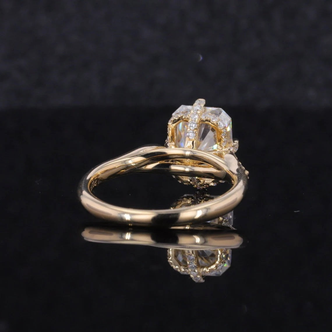 Low-angle side view of a 2 CT radiant cut lab grown diamond engagement ring showing the yellow gold band and hidden pavé halo gallery.