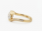 Side view showing the curved bypass band and pavé diamonds of a 3 CT East-West oval lab diamond ring in yellow gold