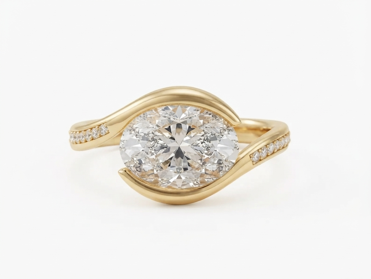 Direct top view of a 3 carat East-West horizontally set oval lab grown diamond ring in yellow gold with pavé details.