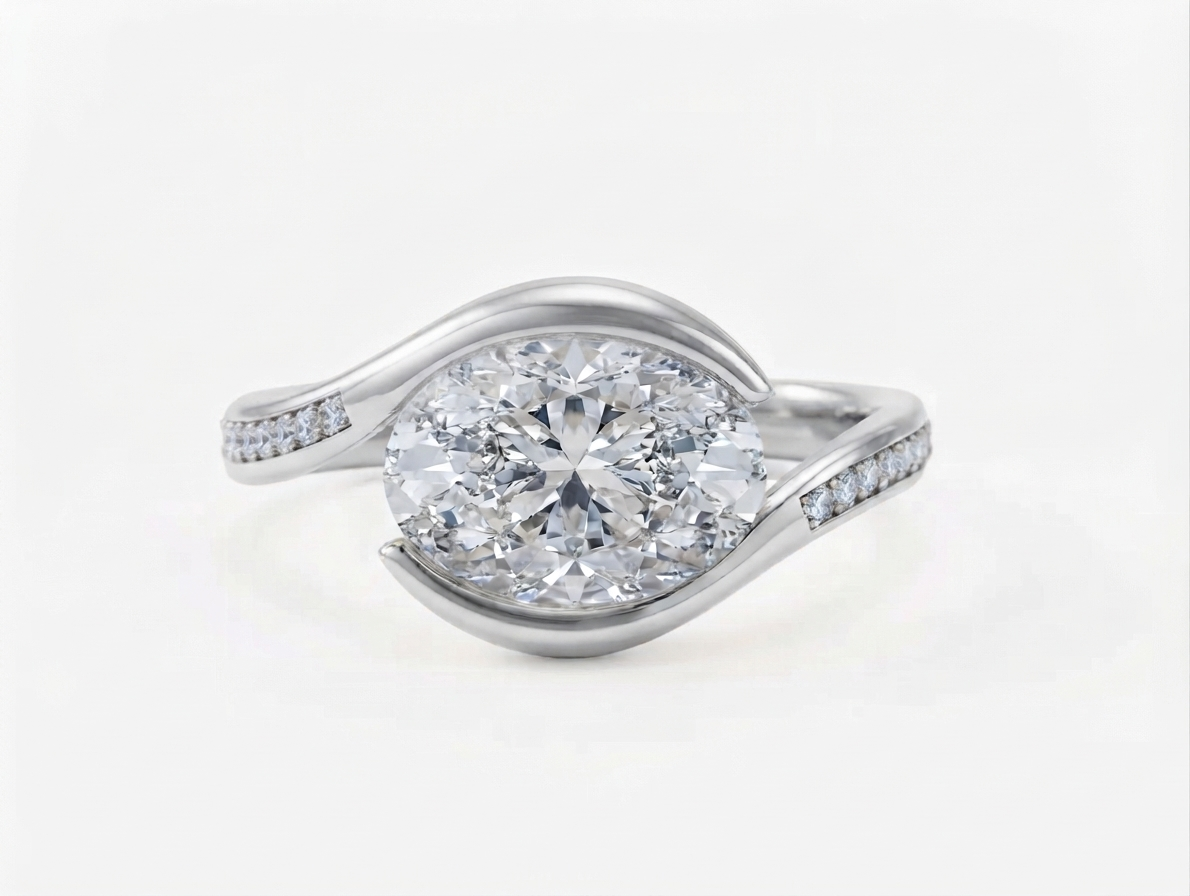 Top-down view of a 3 CT horizontally set oval lab grown diamond bypass ring in white gold with pavé shoulder accents.