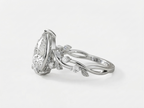 Side angle view of a white gold botanical vine engagement ring featuring a 3 CT pear cut lab grown diamond.