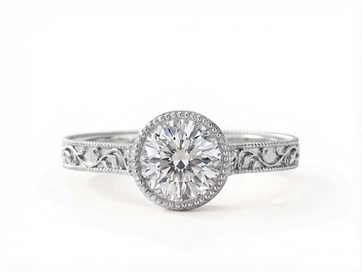 Top-down view of a 3 carat round cut lab grown diamond set in a white gold milgrain bezel ring.