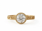 Top view of a 3 CT round lab grown diamond engagement ring in yellow gold with beaded milgrain bezel.