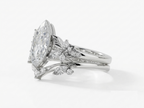 Side view of a white gold 3 CT marquise lab grown diamond engagement ring stacked with matching curved band.