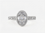 Top-down perspective of a white gold 3 CT oval cut lab grown diamond vintage milgrain engagement ring.