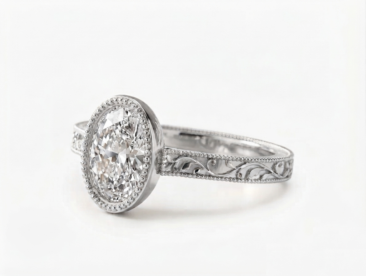 Perspective side view of a white gold 3 carat oval lab grown diamond bezel setting with intricate scrollwork band.