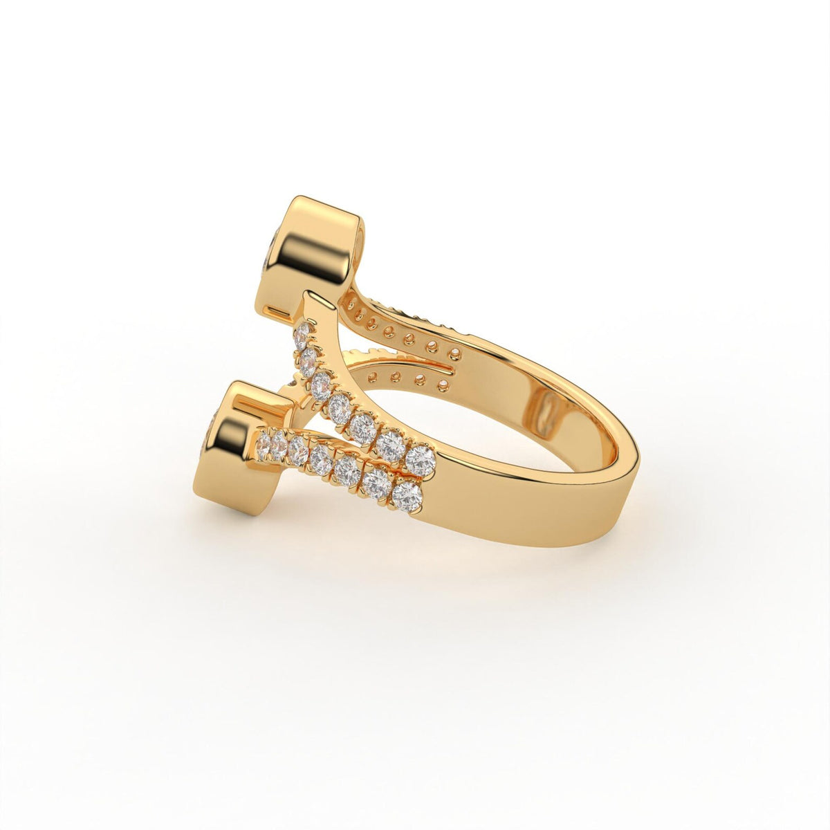 Perspective view of a two stone round lab grown diamond bezel ring in yellow gold with diamond split band.