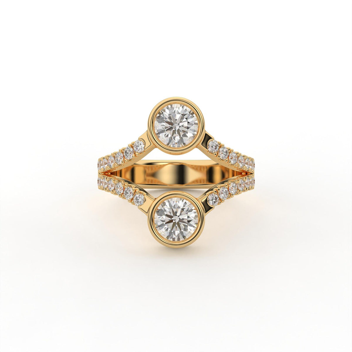Top view of a two stone round cut lab grown diamond engagement ring with bezel settings in yellow gold.