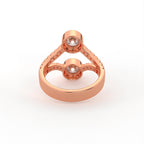 Undergallery view of a rose gold two stone round lab grown diamond bezel setting ring.