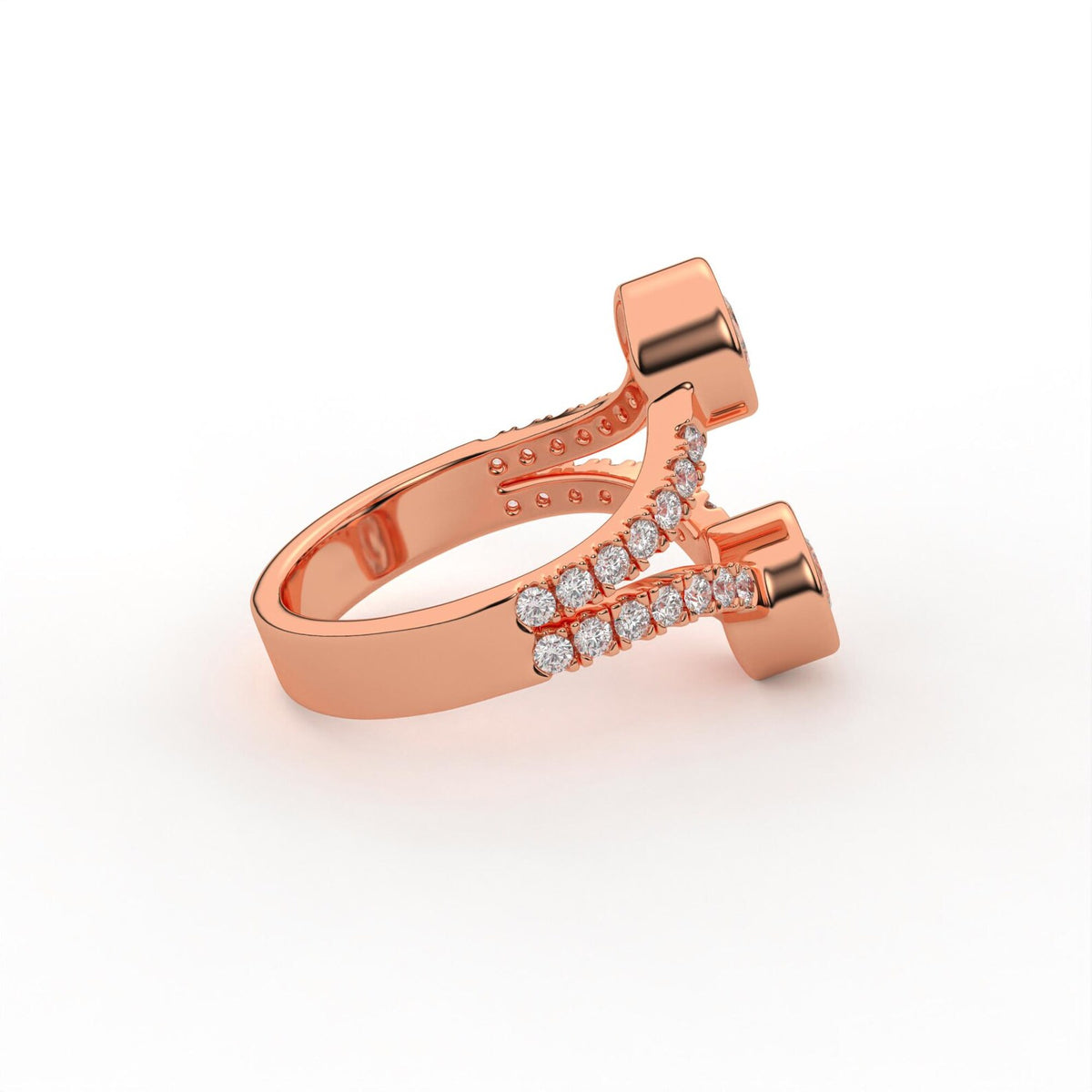 Side profile shot of a rose gold two stone round lab diamond bezel ring with pavé accents.