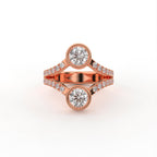 Top-down view of a rose gold Toi et Moi round lab grown diamond bezel ring with split pavé band.