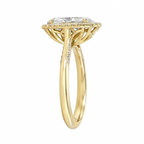 Side perspective view of a yellow gold 3 CT oval lab diamond halo ring with milgrain band and lotus basket.