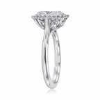 Side angled view of a white gold 3 CT oval lab grown diamond halo ring showing floral undergallery.