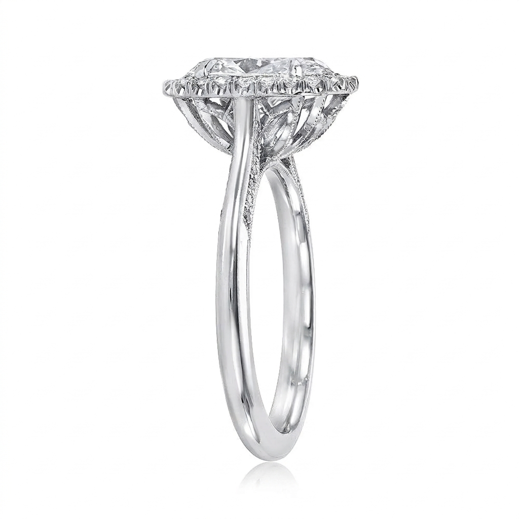 Side angled view of a white gold 3 CT oval lab grown diamond halo ring showing floral undergallery.